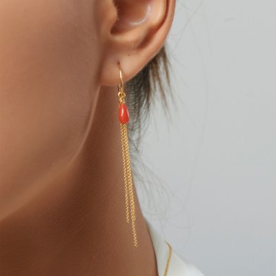 Model wearing Coral Drop Earrings in sterling silver – elegant and natural look.