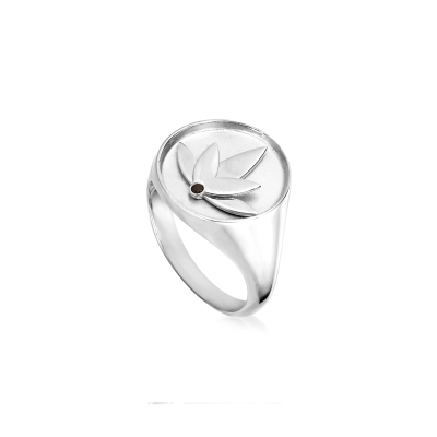 Lotus ring in rhodium-plated recycled sterling silver with hand-set black cubic zirconia, polished finish, and bold design inspired by the symbolism of the lotus flower.