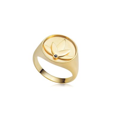 Lotus ring in 24k gold-plated recycled sterling silver with hand-set black cubic zirconia, polished finish, and bold design inspired by the symbolism of the lotus flower.