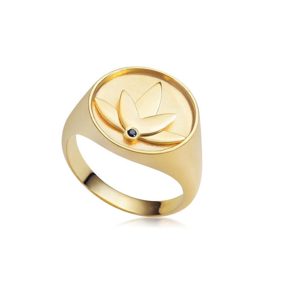 Lotus ring in 24k gold-plated recycled sterling silver with hand-set black cubic zirconia, polished finish, and bold design inspired by the symbolism of the lotus flower.
