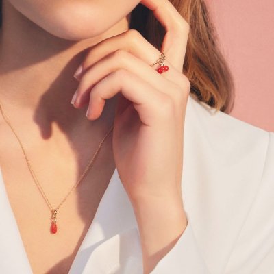 Model wearing Coral Ring in gold-plated silver – feminine and elegant style.
